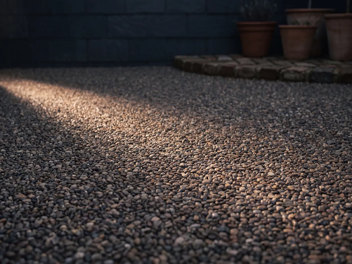 A finished resin bound driveway in a warm natural stone blend, smooth and seamless across a property frontage